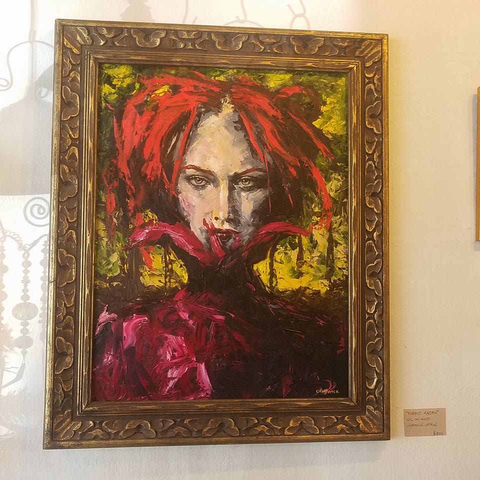 Portrait of a woman with red hair in elaborate frame