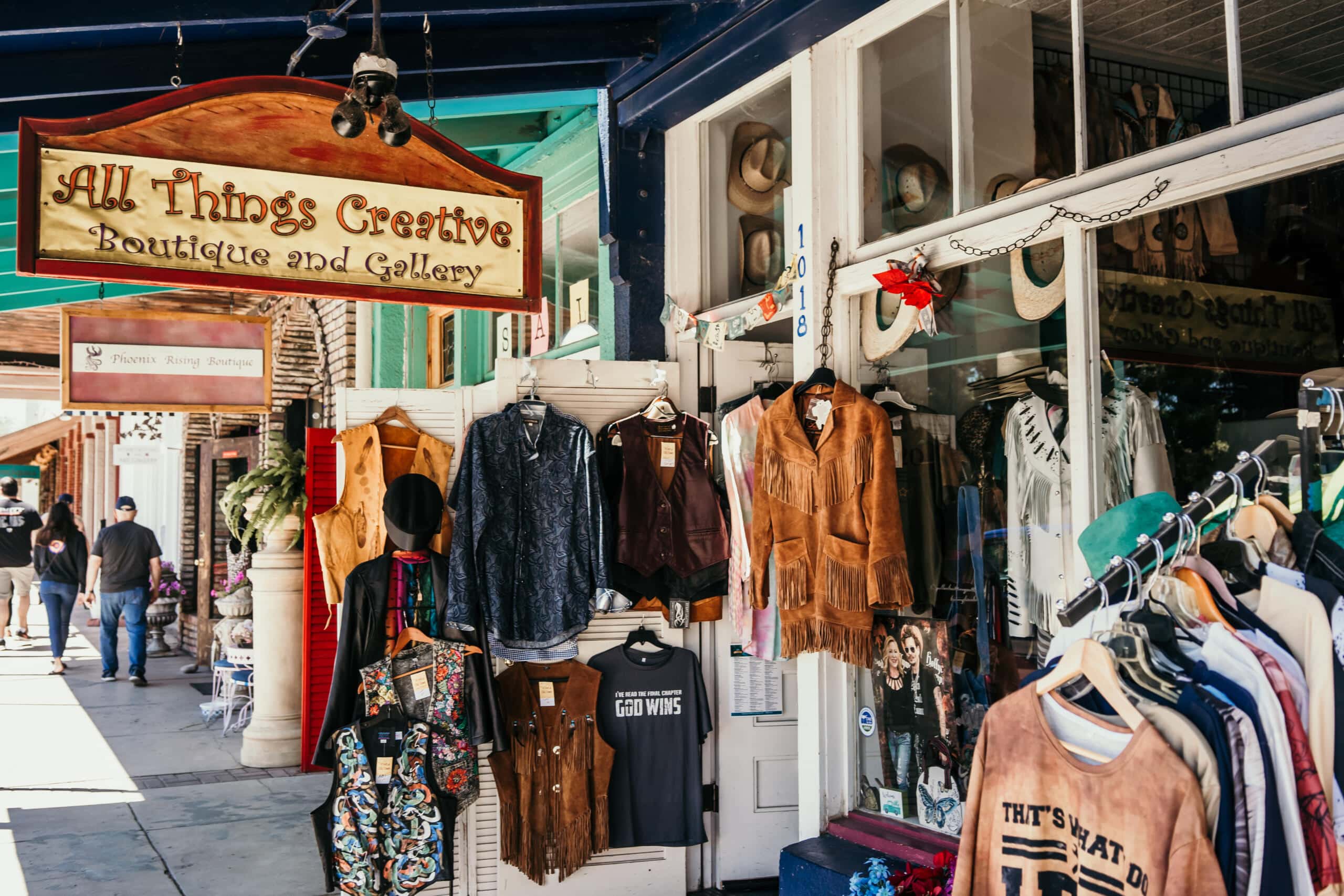 Vintage clothing boutique named All Things Creative with rustic storefront display