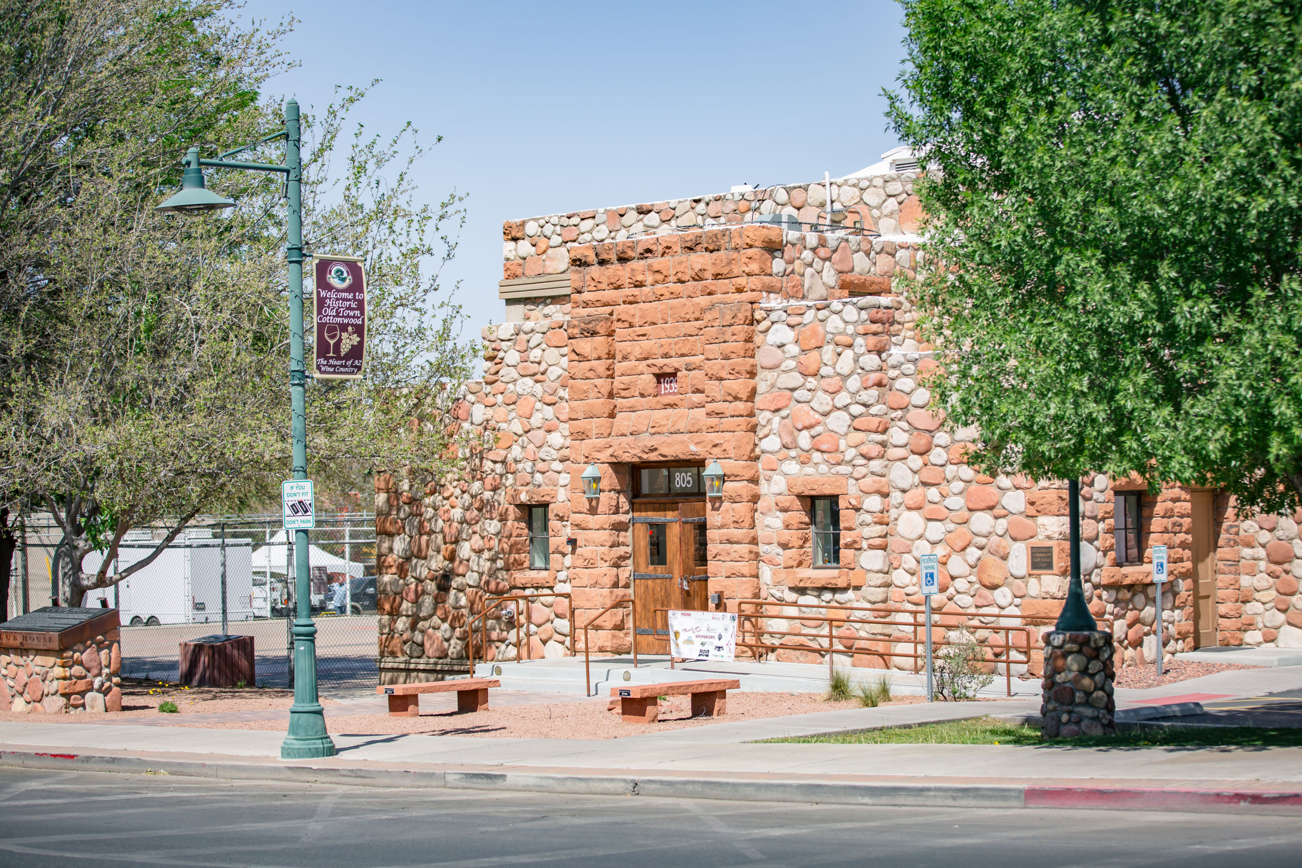 Historic stone building in Old Town Cottonwood, Arizona with welcome sign