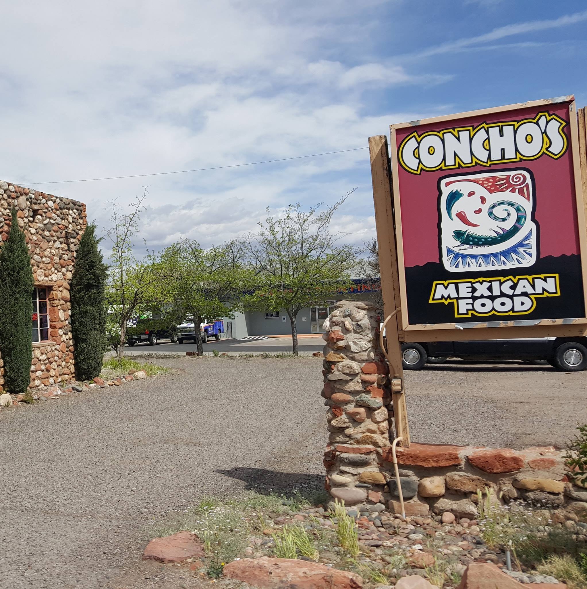 Conchos Mexican Food Food Truck near stone building and parking area