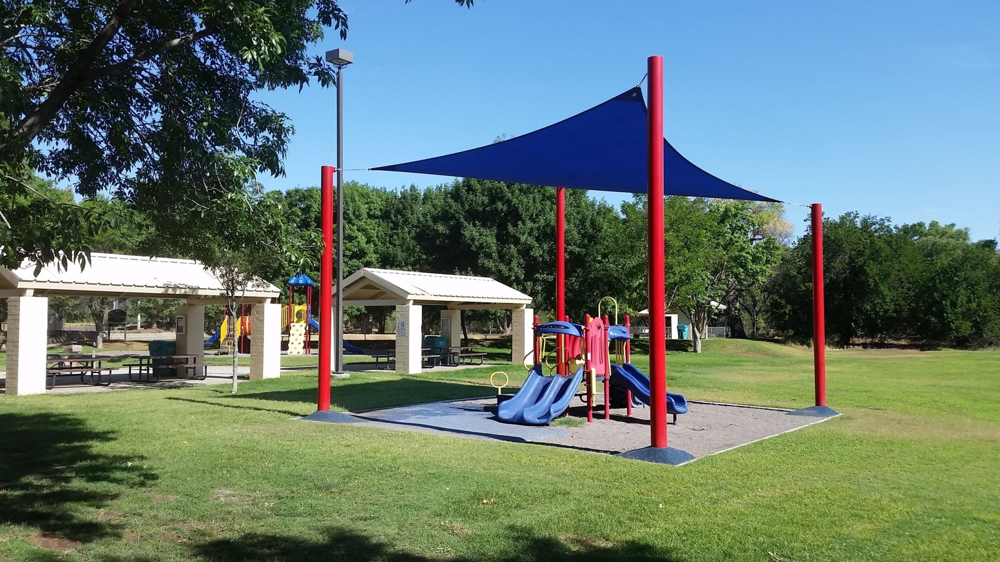 Colorful climbing dome in a park setting