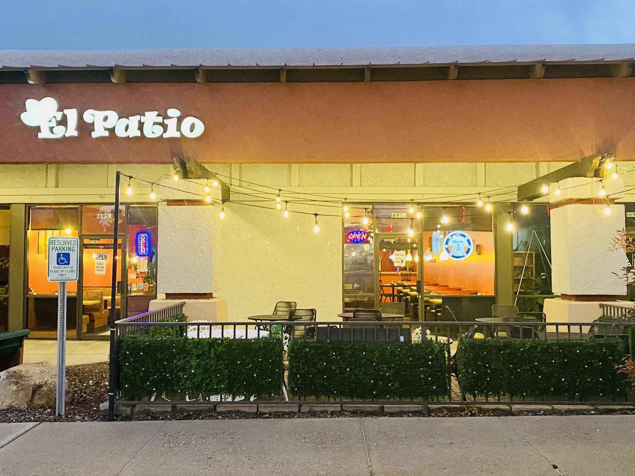 El Patio restaurant exterior with outdoor seating and handicap parking sign