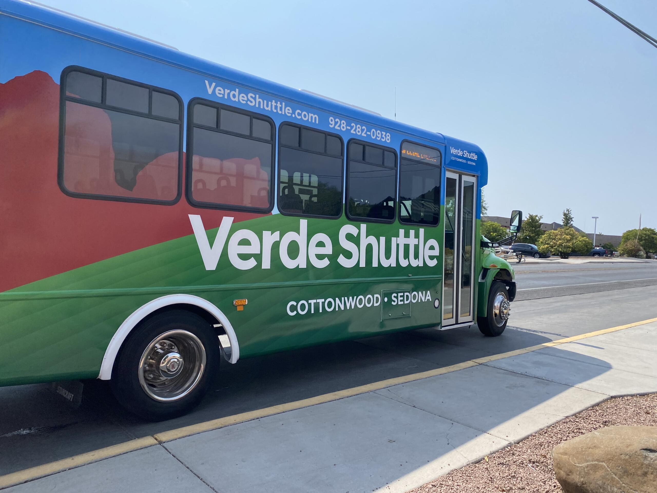 Green Verde Shuttle bus for Cottonwood to Sedona route, parked at station.