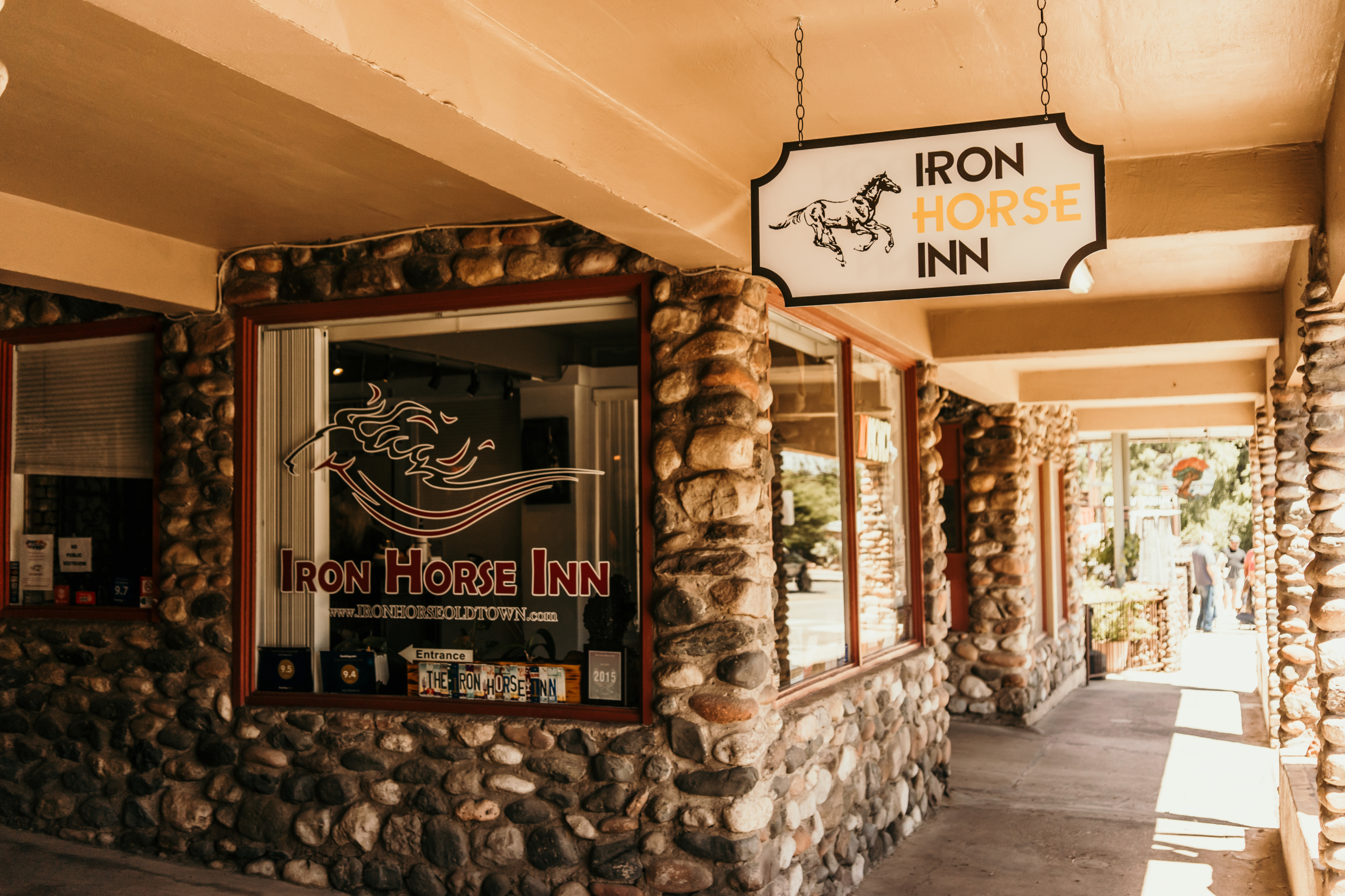 Entrance to Iron Horse Inn, rustic-themed Old Town establishment with horse logo signage