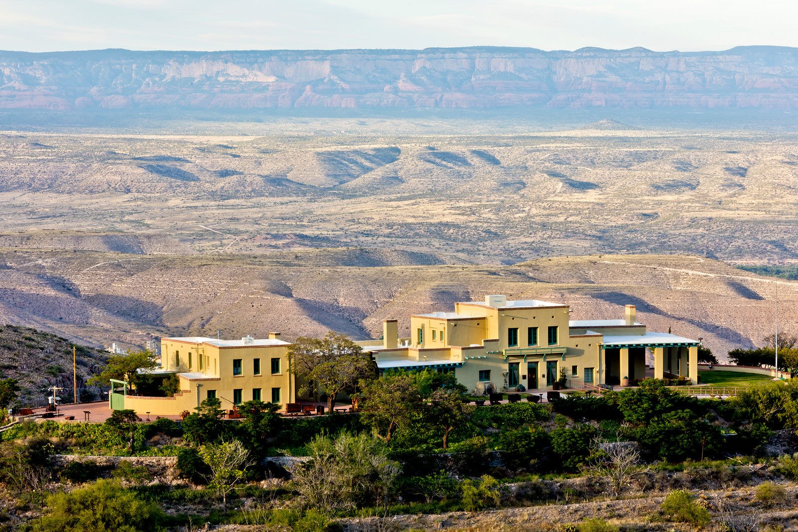 Scenic desert landscape with modern buildings overlooking canyon vistas