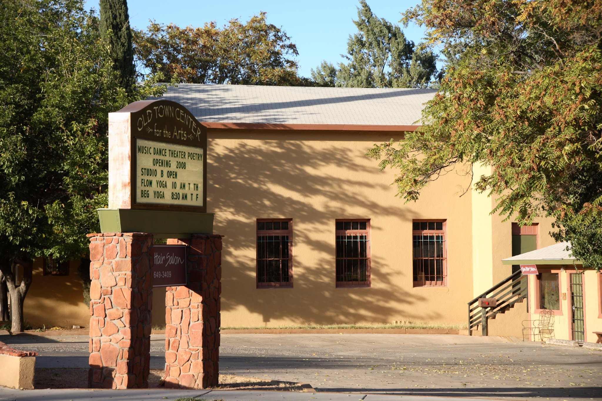 Old Town Center for the Arts building with signage for classes and hair salon.