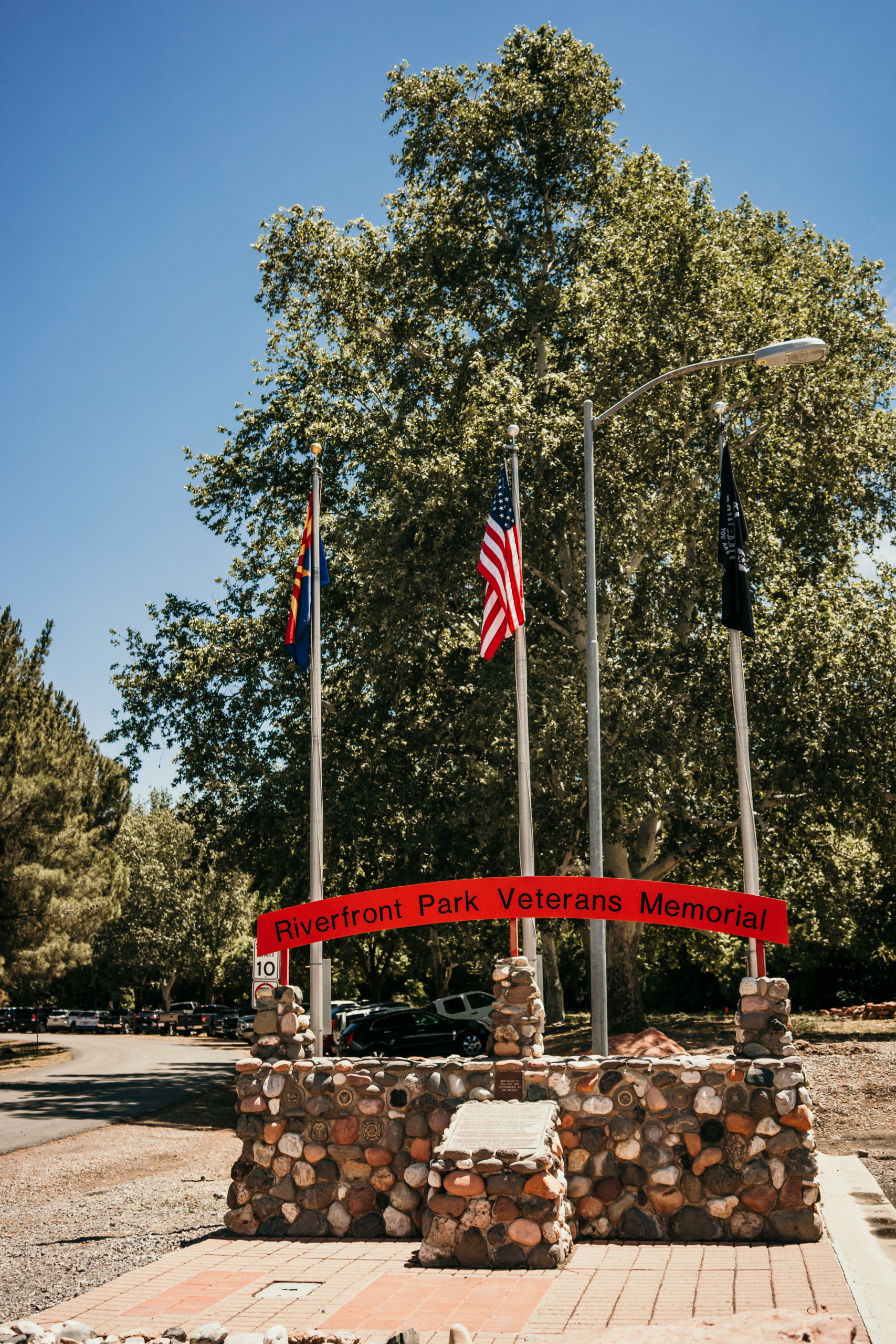 Riverfront Park Veterans Memorial with American flag and state flag displayed.