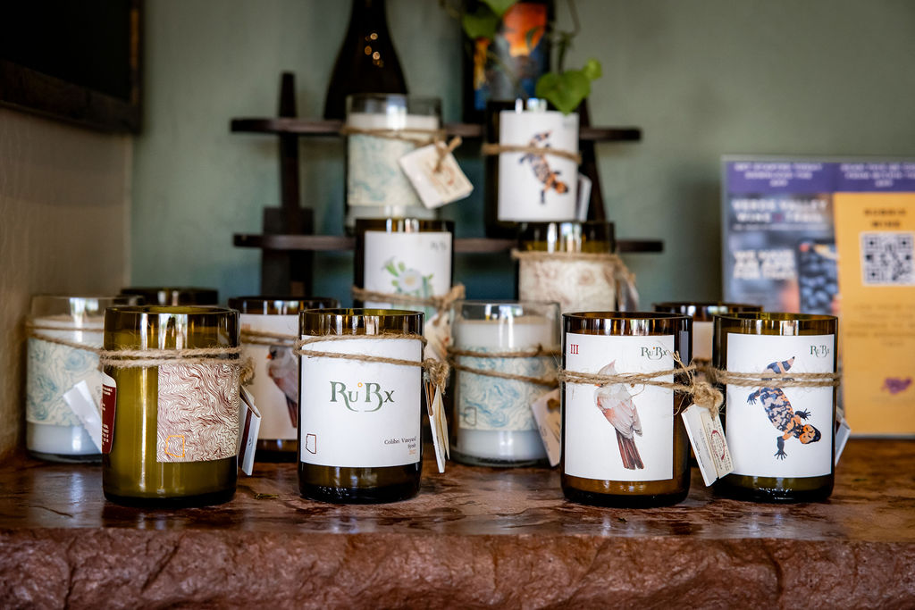 Assorted RuBx scented candles with natural twine and tags on display