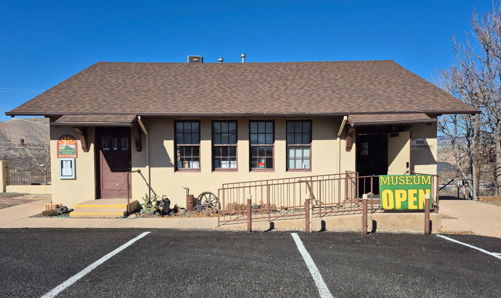 Two-story museum building with open sign
