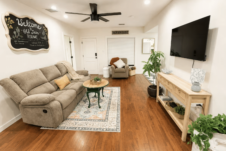 Cozy farmhouse living room with recliner sofa and television