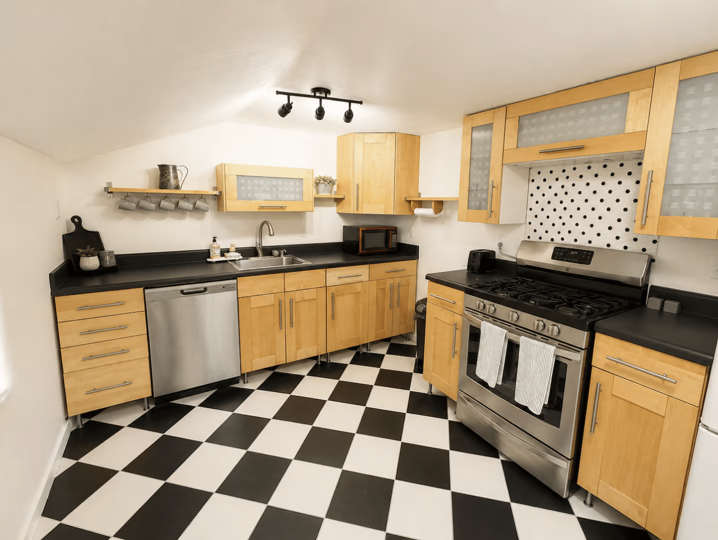 Modern kitchen with maple cabinets and checkered floor