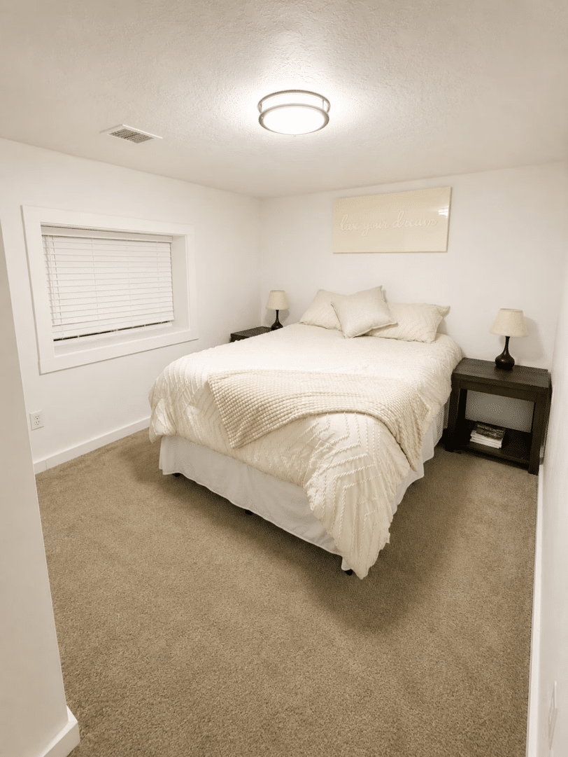 Cozy neutral bedroom with queen bed and nightstands